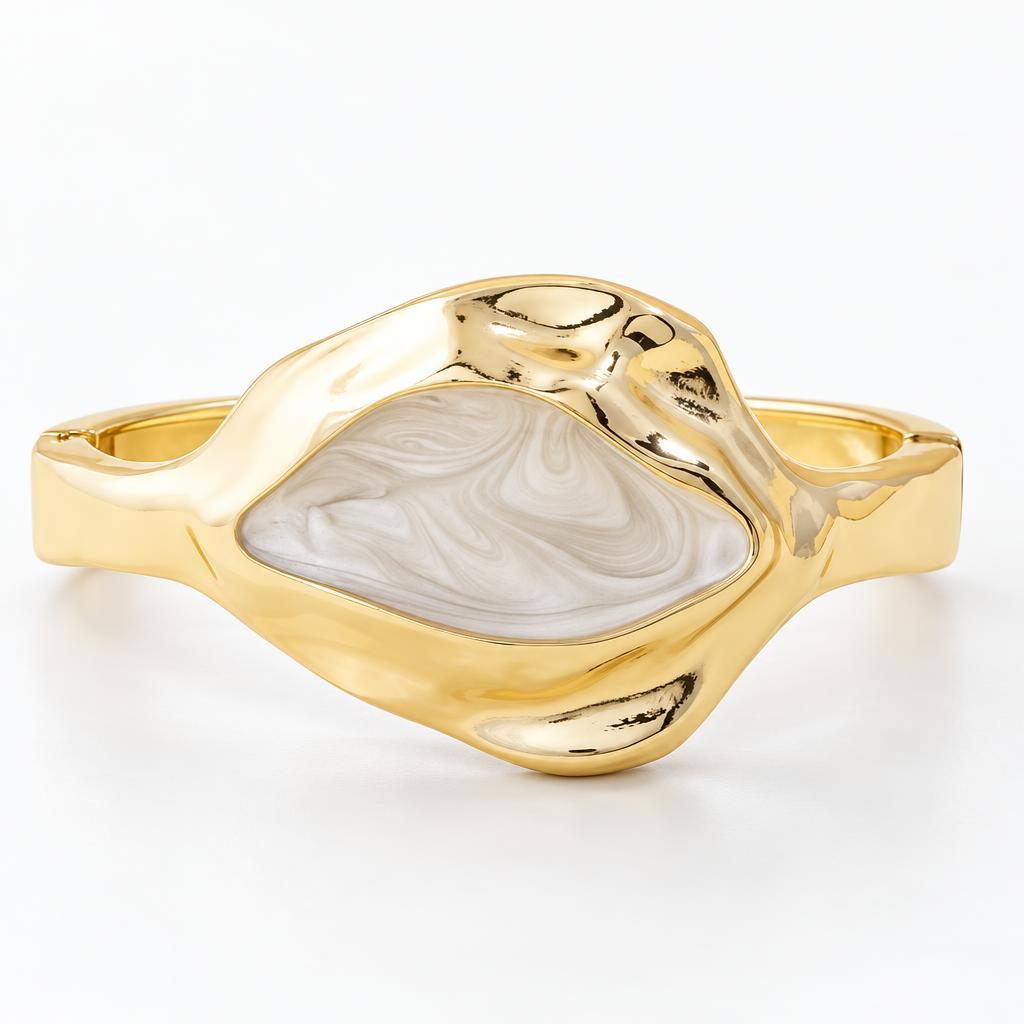 Gold bracelet with a marbled white stone centerpiece.