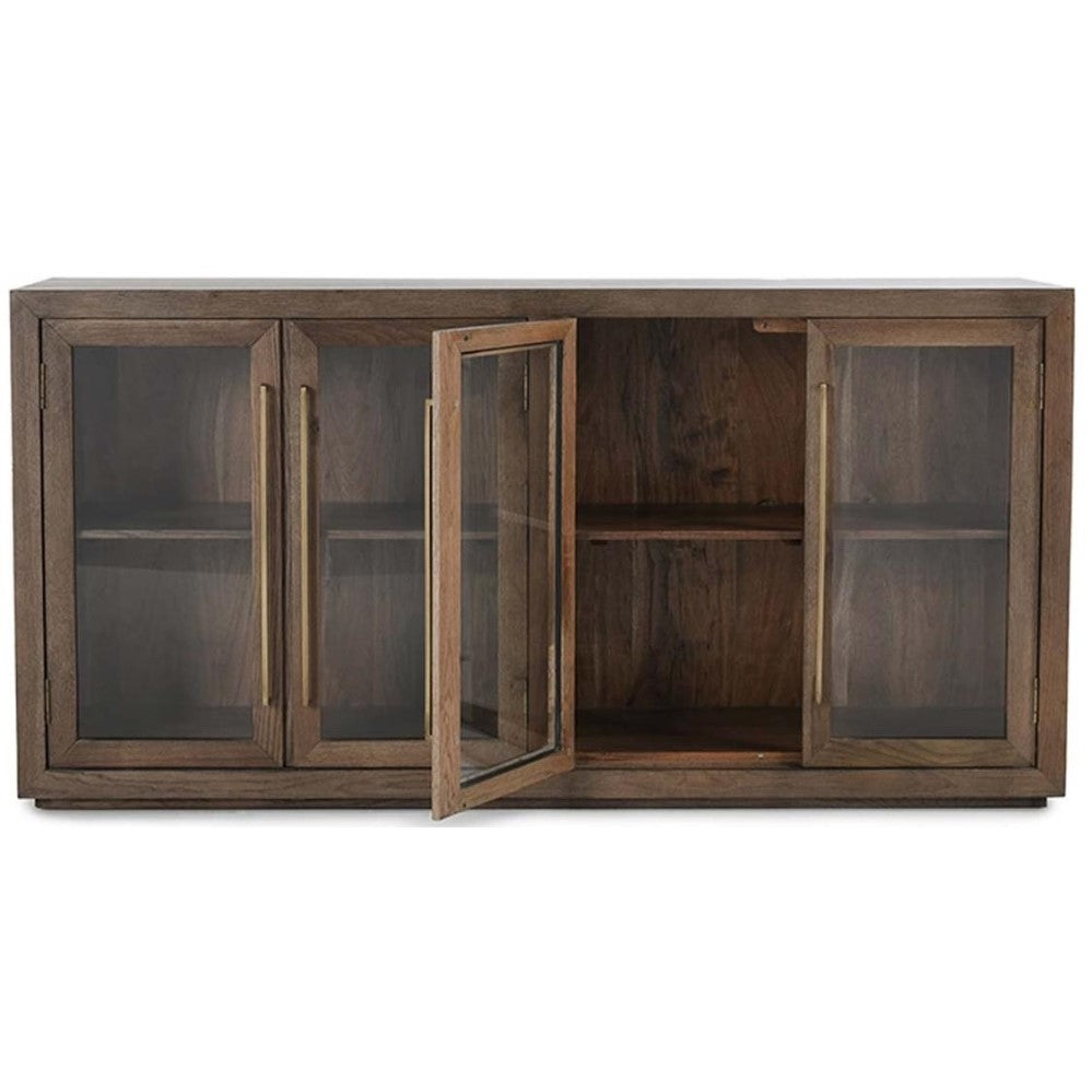 Wooden sideboard with books, plants, and art on a wall. Cozy and elegant decor.