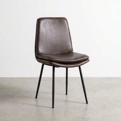Brown leather chair with metal legs, side view.
