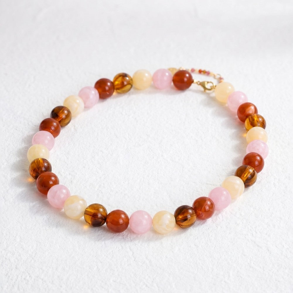 Colorful beaded bracelet on a white surface.
