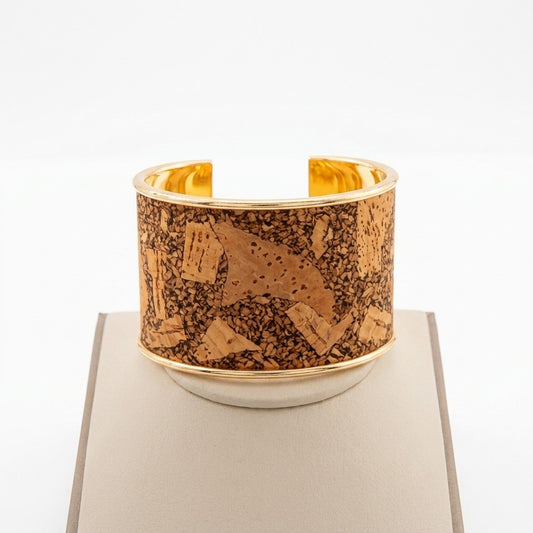 Gold cuff bracelet with cork texture design.