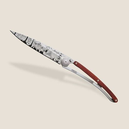 Elegant folding knife with wood handle and engraved metal blade.
