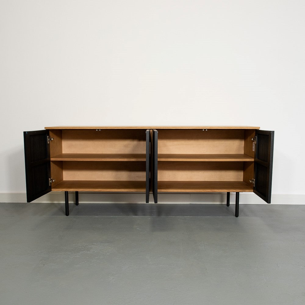 Wooden cabinet with black doors open, showing empty shelves inside.