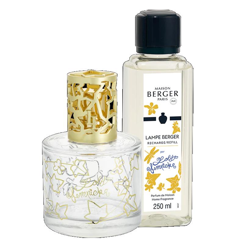 Clear glass lamp with a golden decorative top and a fragrance refill bottle.