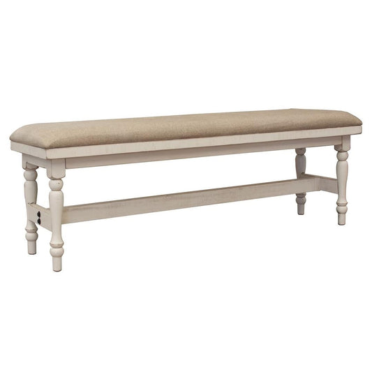 A beige upholstered bench with turned wooden legs.