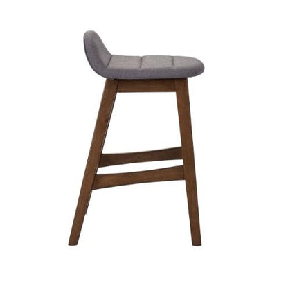 Wooden stool with a gray cushioned seat, side view.