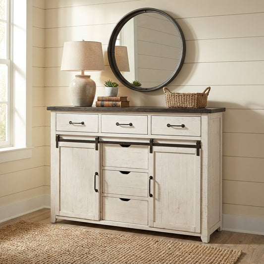 White cabinet with black tabletop and sliding barn doors.