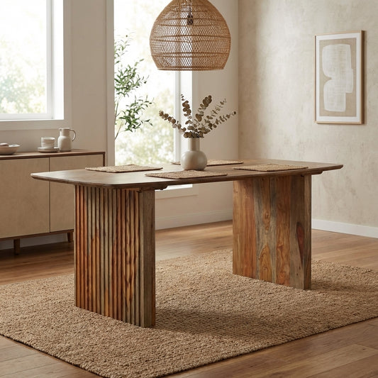 Rustic wooden table with slab legs and natural grain finish.