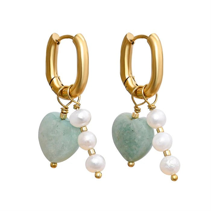 Gold hoop earrings with jade hearts and pearl accents.