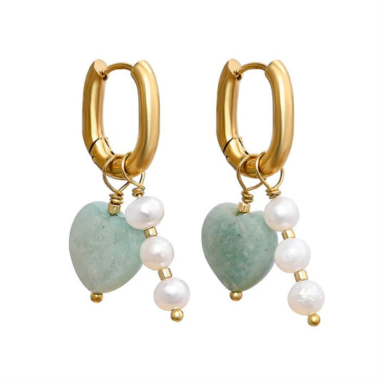 Gold hoop earrings with jade hearts and pearl accents.