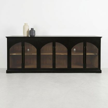 Dark wooden cabinet with glass doors and vases on top.