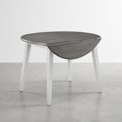 Gray and white drop-leaf round table with clean lines.