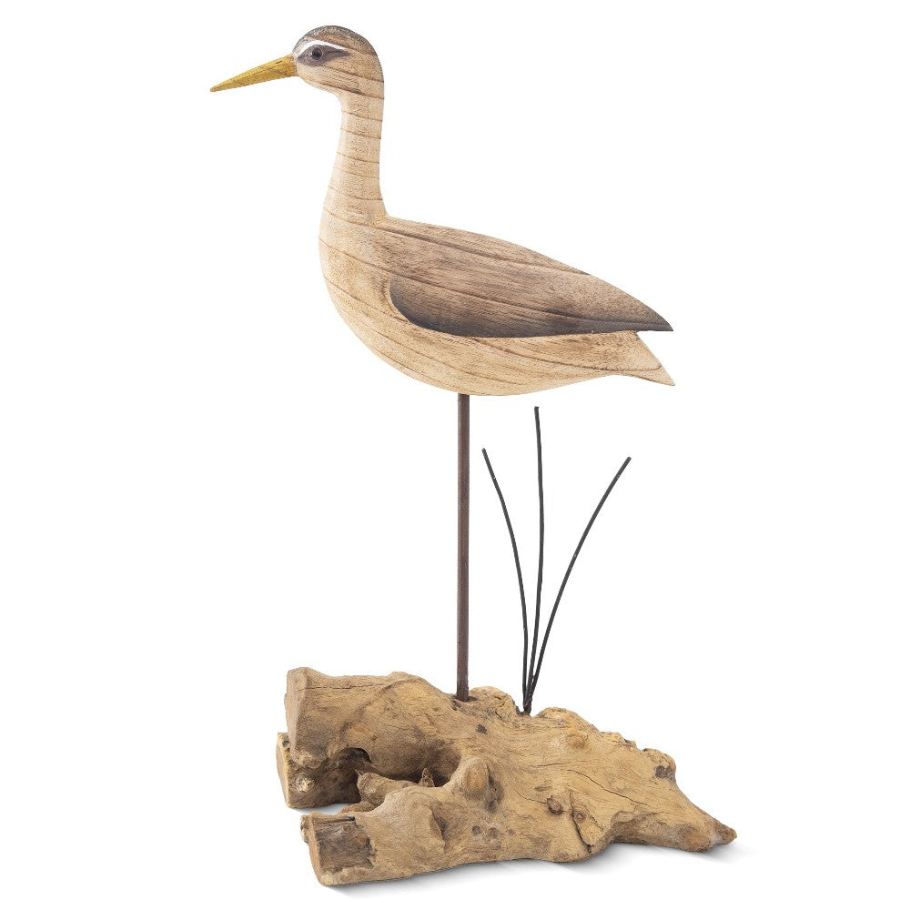 Wooden bird sculpture on driftwood base.