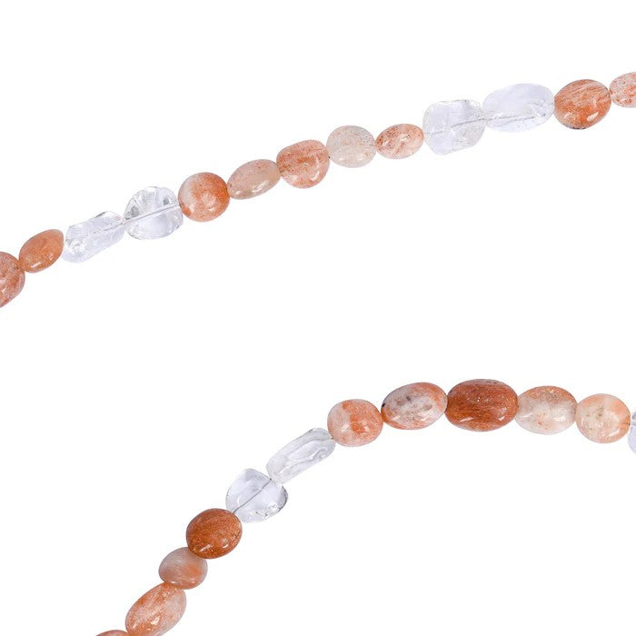 Orange and white beaded necklace strands on a white background.