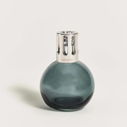 Elegant glass fragrance lamp with silver top on white background.