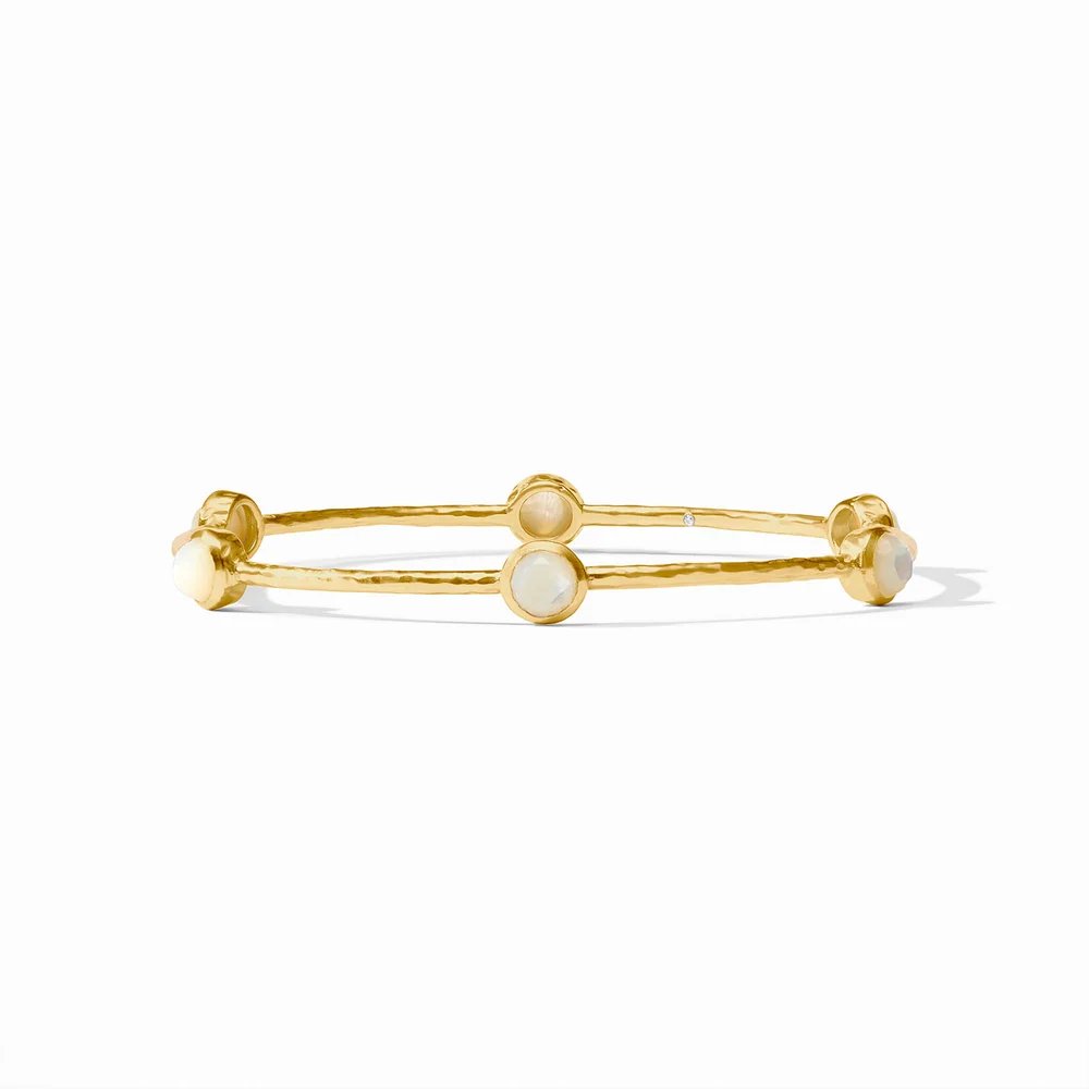 Gold bangle bracelet with round opal accents and a small diamond, on a white background.