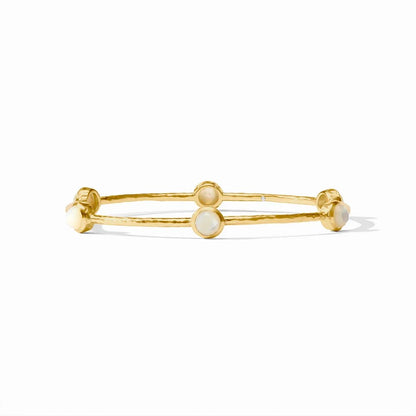Gold bangle bracelet with round opal accents and a small diamond, on a white background.