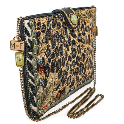 Beaded animal print clutch with chain strap and intricate details.
