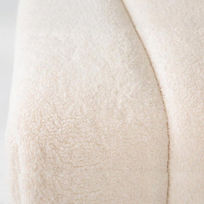 Close-up of a textured, cream-colored woolly fabric surface.