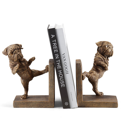 Dog statue bookends holding up two books.