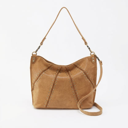 Tan leather handbag with studded design and detachable strap.