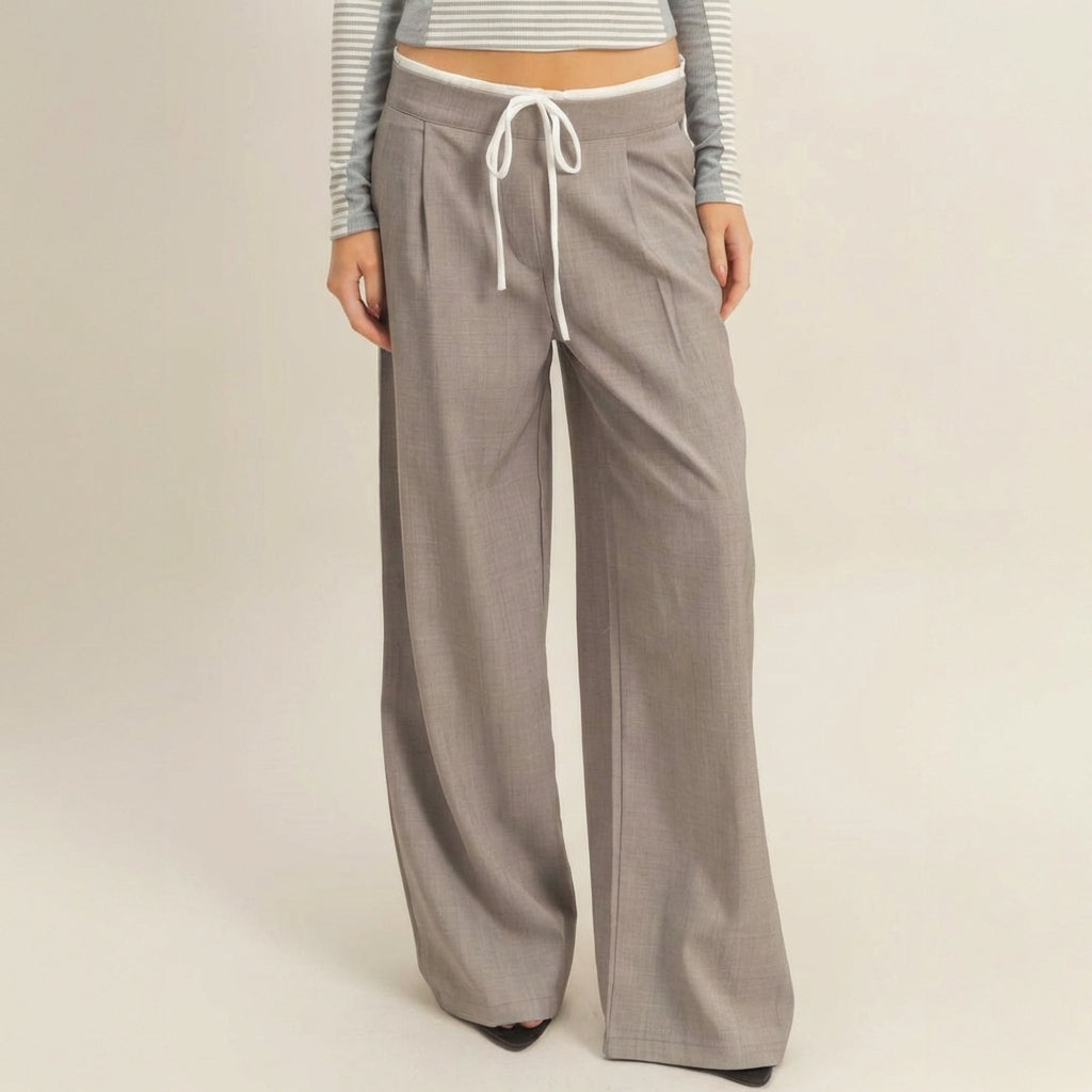 Gray wide-leg pants with drawstring, cropped striped top.