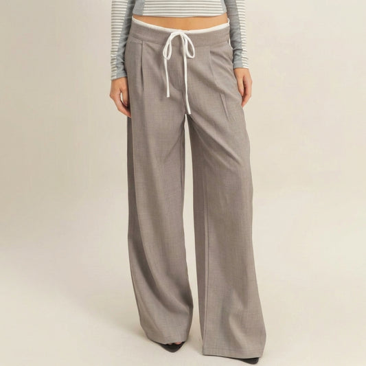 Gray wide-leg pants with drawstring, cropped striped top.
