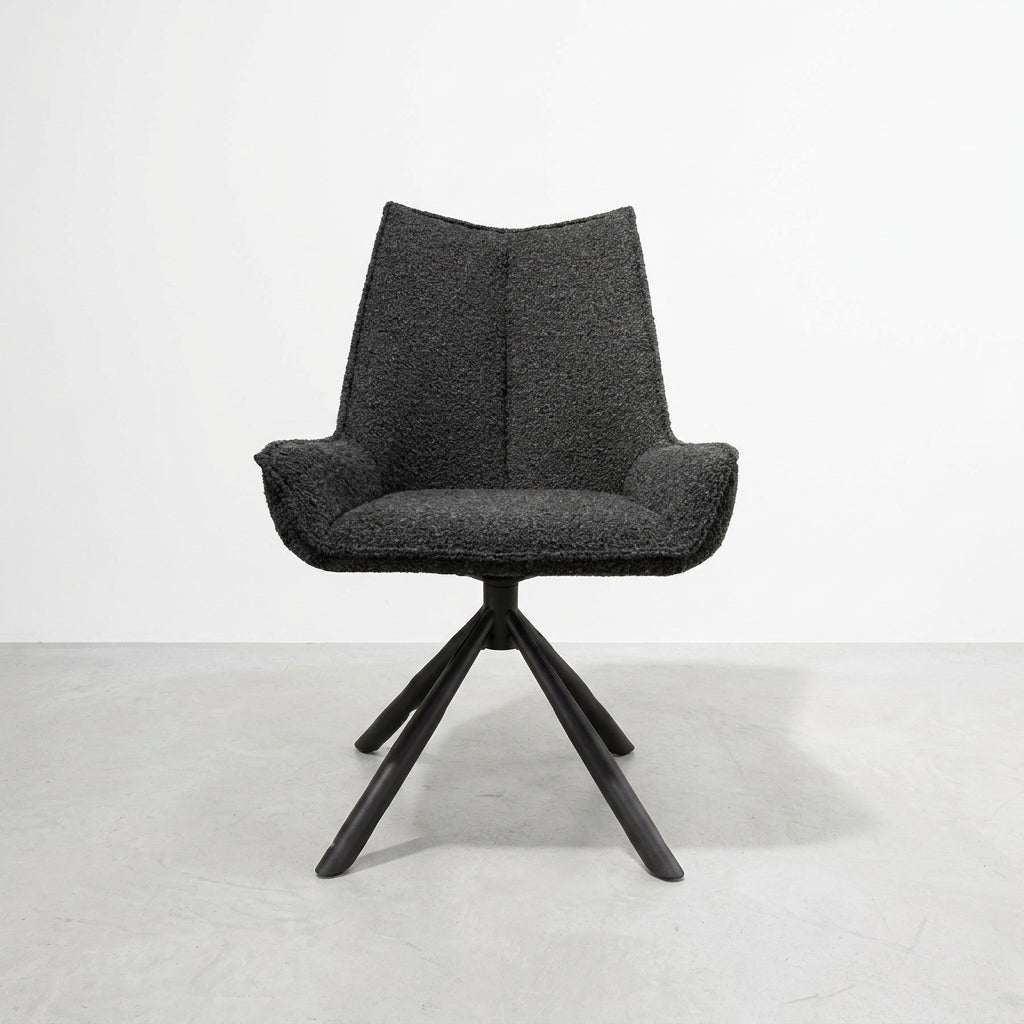 Dark armchair with textured fabric and wooden legs on a white background.