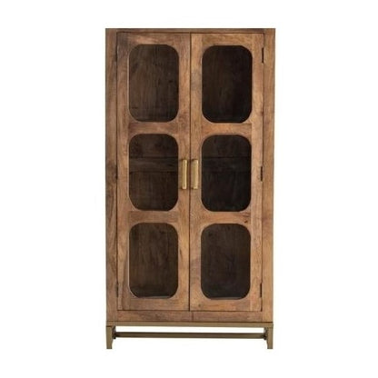 Wooden cabinet with glass panel doors and brass handles.