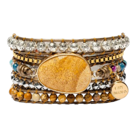Stacked bracelets with beads, stones, and metallic accents, featuring a large central stone.