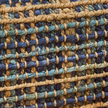 Close-up of a woven fabric in blue and beige hues with a textured pattern.