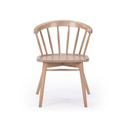 Wooden chair with a curved back and vertical slats.