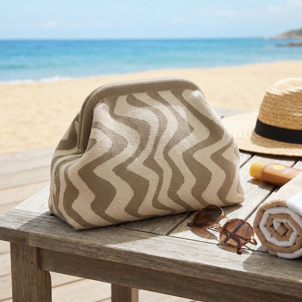 Beach essentials on a wooden table by the sea.