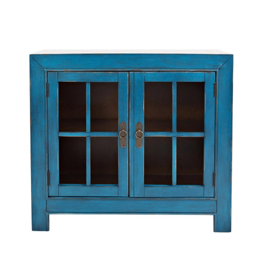 Blue cabinet with glass doors and metal handles.