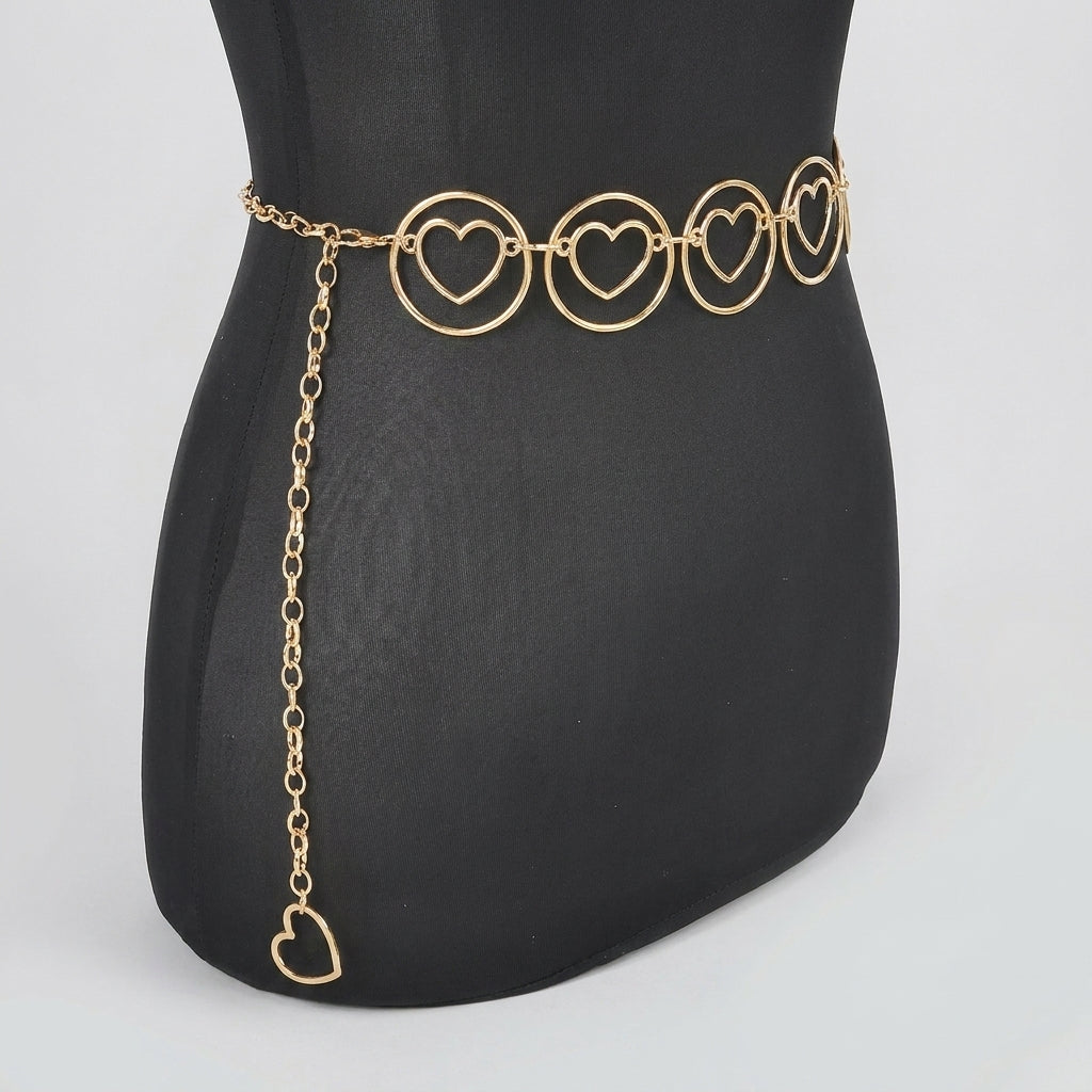 Gold heart chain belt on black mannequin.