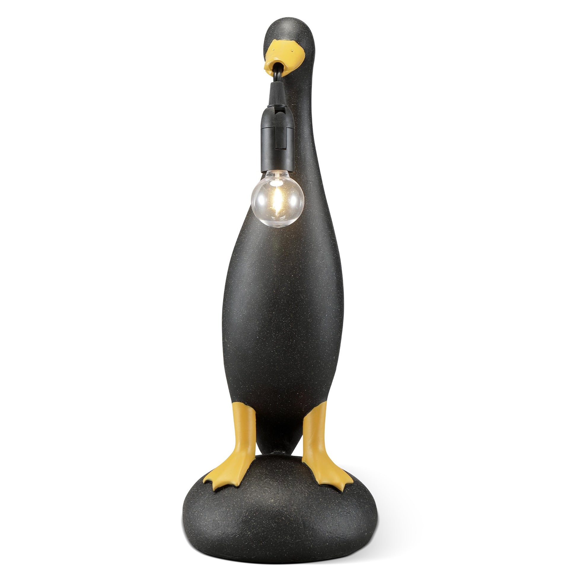 Penguin-shaped lamp with bulb in beak on rock base.