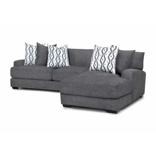 Gray sectional sofa with patterned cushions.