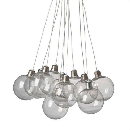 Cluster of clear glass bulbs hanging by cords.