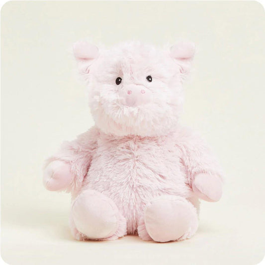 Fluffy pink pig plush toy with a cute expression.