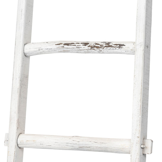 A weathered, white wooden ladder with chipped paint.