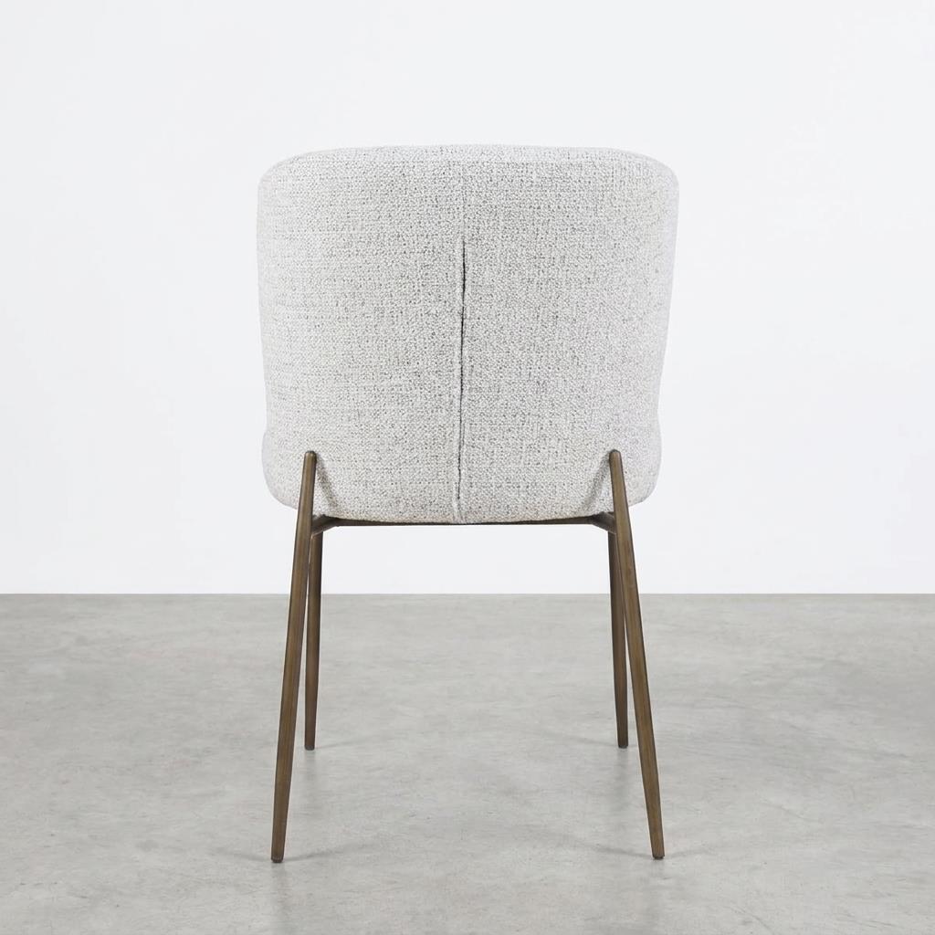 Cream upholstered chair with wooden legs on a plain background.