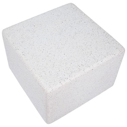 White pumice stone block with a rough texture.