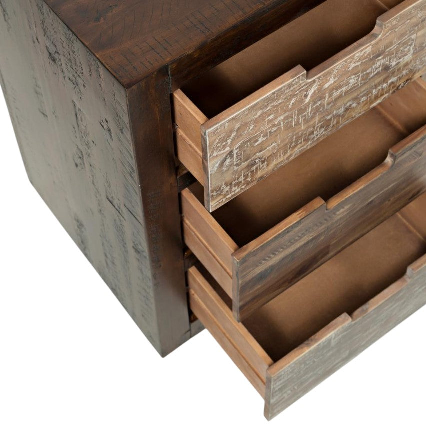 Wooden cabinet with three open drawers, rustic texture.