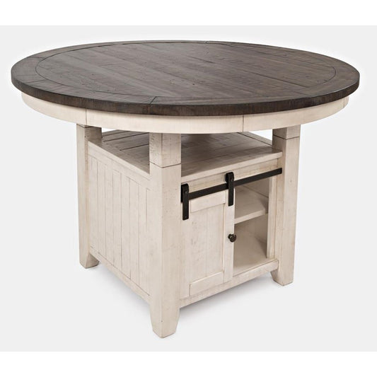 Rustic round table with storage and sliding barn door.