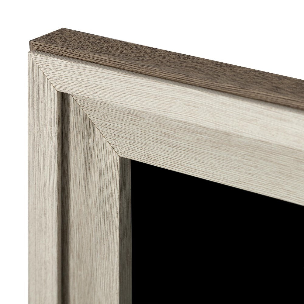 Close-up of a wooden frame corner with a dark inset.