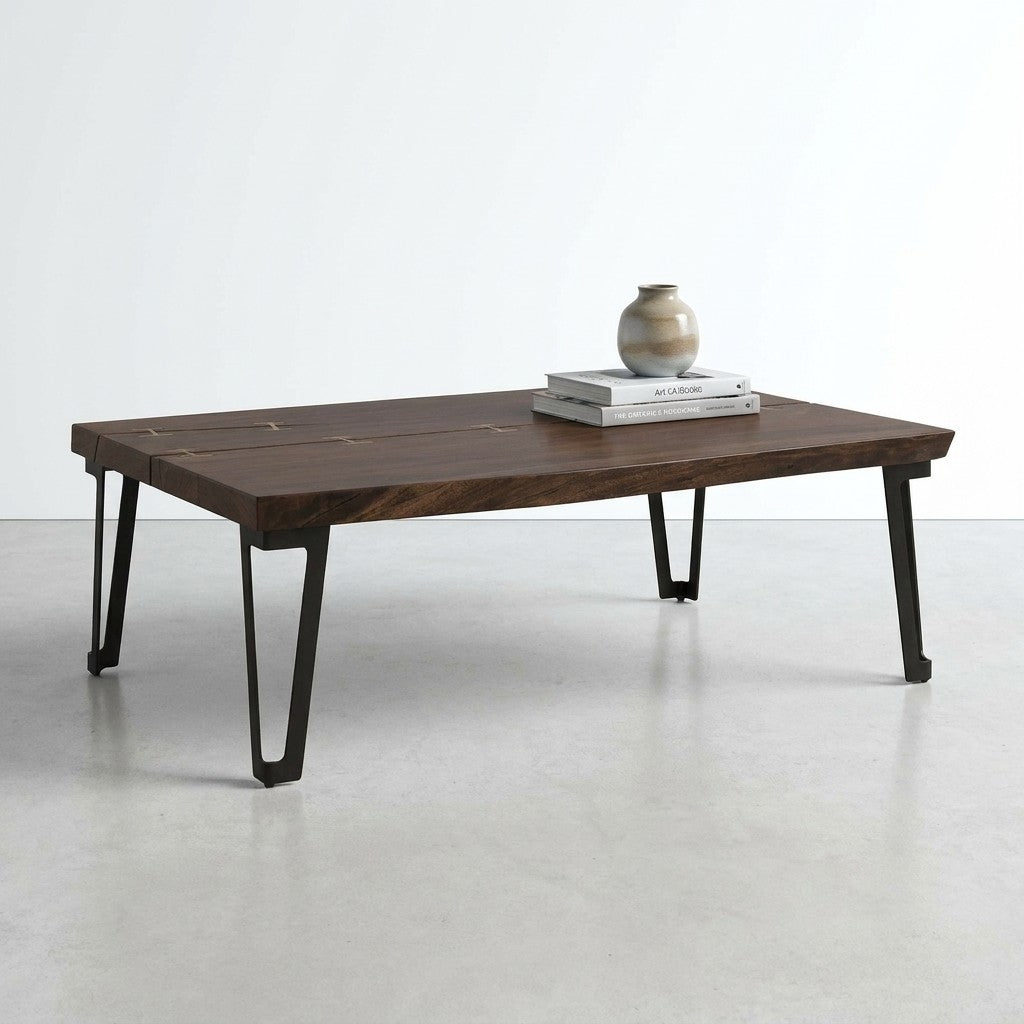 Dark wooden table with metal legs and decorative inlays.