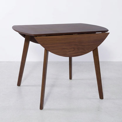 Wooden table with foldable semicircular leaves on both sides.