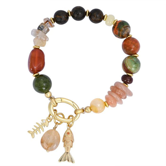 Colorful beaded bracelet with fish pendants.