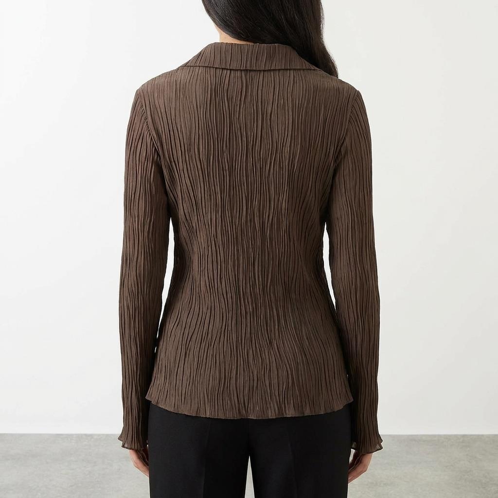 Back view of a brown crinkled blouse with collar, worn by a person with long hair.