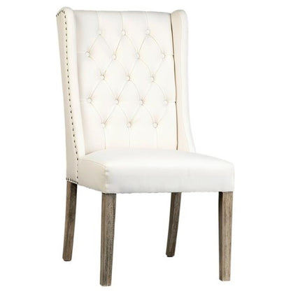 White tufted chair with wooden legs.